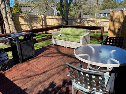 Edgartown Martha's Vineyard vacation rental - View of back yard, outdoor shower, and deck with gas grill.