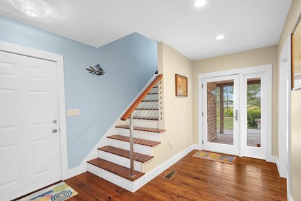 Edgartown Martha's Vineyard vacation rental - Stairway to Master Suite and door to back deck / screen porch