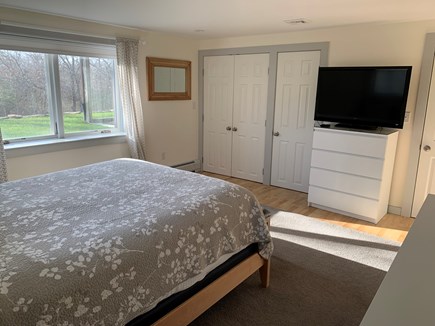 Chilmark Martha's Vineyard vacation rental - Bedroom 4 with queen on first floor with view of closet and TV
