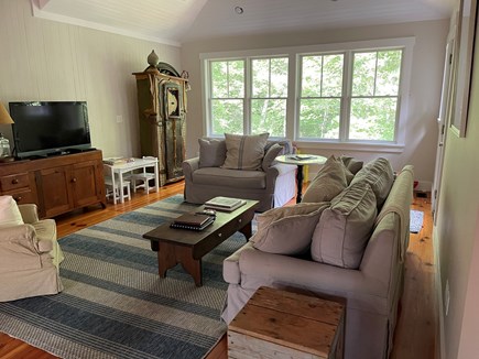 West Tisbury Lambert's Cove Martha's Vineyard vacation rental - Living room. Down-filled couches. Armoire filled with games.