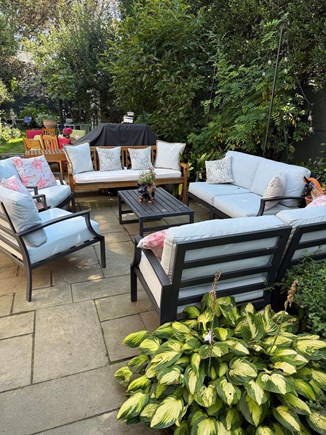 In town Edgartown village Martha's Vineyard vacation rental - Outdoor seating adjacent to dining table that seats eight & grill