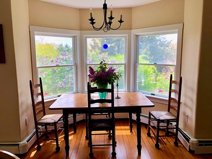 Edgartown Martha's Vineyard vacation rental - Breakfast table in kitchen looking to side yard
