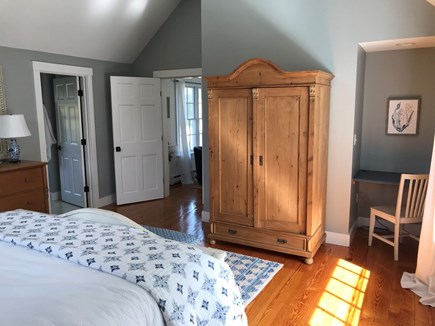 Edgartown Martha's Vineyard vacation rental - Primary king bedroom showing private bath and built-in desk