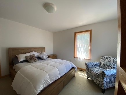 Oak Bluffs Martha's Vineyard vacation rental - Bedroom 1 features queen bed, sitting chair, and walk-in closet.