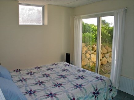 Chilmark Martha's Vineyard vacation rental - Lower level queen bedroom w/ sliding glass doors to yard & view