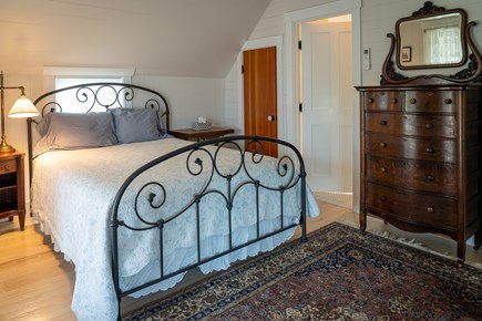 Heart of Oak Bluffs Martha's Vineyard vacation rental - Upstairs bedroom with queen bed, bath and door to upstairs porch.