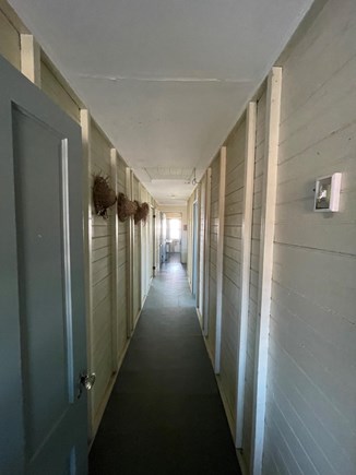 Chilmark, The Camp // Gadget Martha's Vineyard vacation rental - Front Hall. Bedrooms to the right and Kitchen Living to the left.