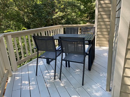 Oak Bluffs Martha's Vineyard vacation rental - Outdoor dining next to kitchen surrounded by trees