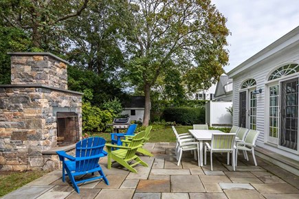 Edgartown Martha's Vineyard vacation rental - Backyard patio, fireplace, outdoor shower and shed with 8 bikes