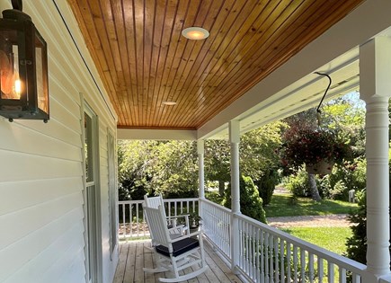 Edgartown Martha's Vineyard vacation rental - West side of wraparound porch with two rocking chairs.