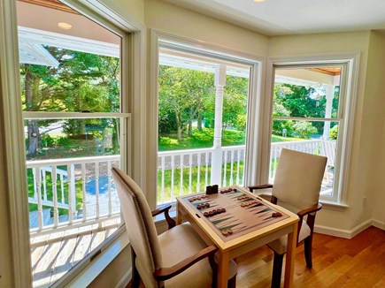 Edgartown Martha's Vineyard vacation rental - Game table (with backgammon/chess) by dining room picture window.