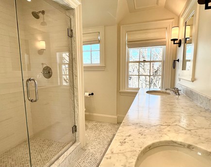Edgartown Village Martha's Vineyard vacation rental - Primary bathroom with double vanity and glass walk-in shower.