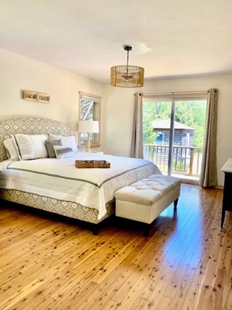 Oak Bluffs - Lagoon Pond Martha's Vineyard vacation rental - Primary Bedroom, king bed, en suite, opens to deck and pool