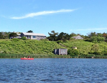 Chilmark Martha's Vineyard vacation rental - View of house (center left) & dock from pond