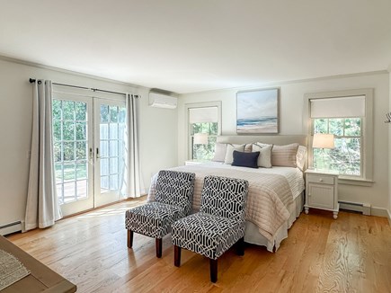 Oak Bluffs Martha's Vineyard vacation rental - Primary bedroom w/ en suite and doors to back deck