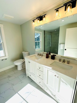 Oak Bluffs Martha's Vineyard vacation rental - 2nd-floor primary bedroom en suite bath features a tile shower.