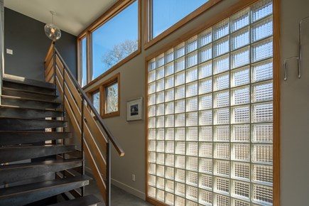 Oak Bluffs - East Chop Martha's Vineyard vacation rental - Wall of glass and staircase to main bedroom.