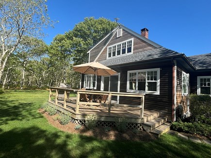 Edgartown Martha's Vineyard vacation rental - Side of house with deck. You can see lawn in the background.<br/>