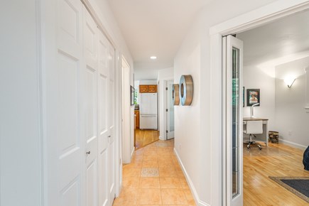 VIneyard Haven  Martha's Vineyard vacation rental - Front hall to kitchen.  Radiant floors.  Office to the right.