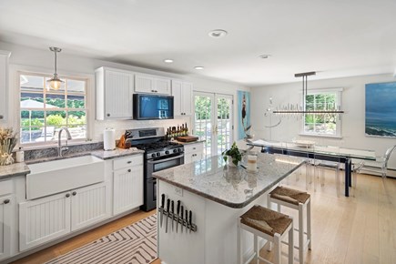 Edgartown Martha's Vineyard vacation rental - Kitchen and dining. Sliders open to backyard and pool area