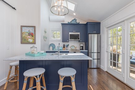 Edgartown, Island Grove Martha's Vineyard vacation rental - Kitchen Area with Counter Seating and Doors to Deck