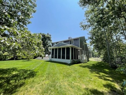 Katama-Edgartown Martha's Vineyard vacation rental - View of the screened porch & deck from the grassy yard