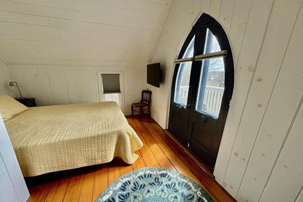 Oak Bluffs Martha's Vineyard vacation rental - Queen bed with balcony with TV and View of Sunset Pond