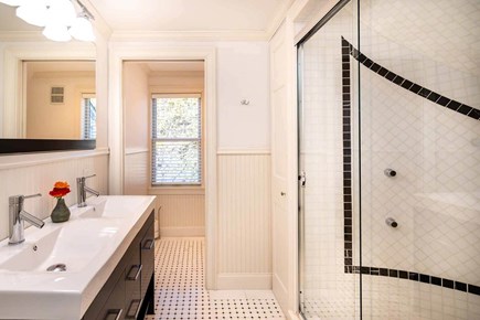 Edgartown Martha's Vineyard vacation rental - Primary bath with glass walk-in shower and double vanity.