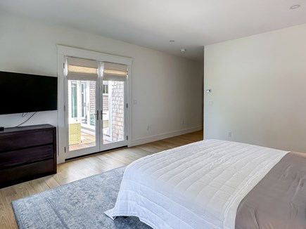 Edgartown Martha's Vineyard vacation rental - First floor King bedroom with doors to backyard and deck area