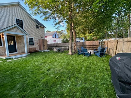 Oak Bluffs, Heritage Haven Martha's Vineyard vacation rental - Private backyard with outdoor shower, grill, firepit, and dining.