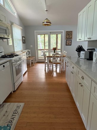 Vineyard Haven Martha's Vineyard vacation rental - Kitchen view through dining to screened in porch