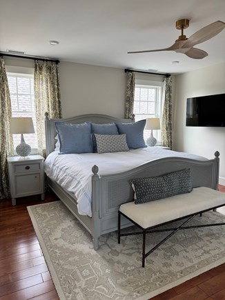 Edgartown  Martha's Vineyard vacation rental - Spacious king bedroom with sitting area and wall-mounted TV.
