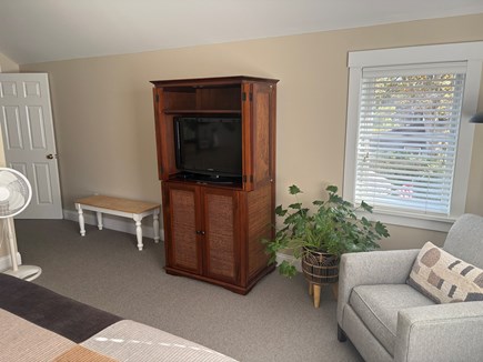 Oak Bluffs Martha's Vineyard vacation rental - Primary 2nd floor king bedroom with seating area and armoire TV