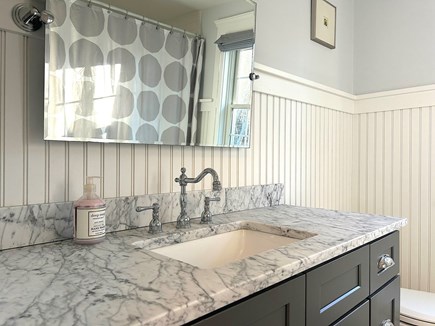 Edgartown Martha's Vineyard vacation rental - Upstairs shared bathroom with a marble vanity and tub/shower