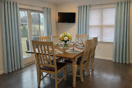 Vineyard Haven Martha's Vineyard vacation rental - Dining area with new furniture, curtains and setting AI generated