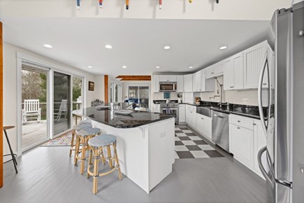 Oak Bluffs Martha's Vineyard vacation rental - Kitchen with Counter Seating and Sliders to the Back Deck