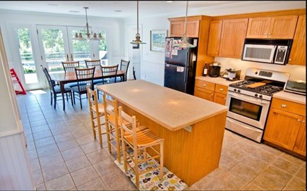 Edgartown Martha's Vineyard vacation rental - Kitchen & dining table - double doors open to deck.