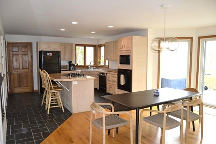 West Tisbury South Shore Martha's Vineyard vacation rental - Kitchen to Dining Room with slider to back deck.