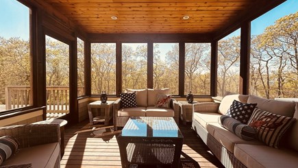 Chilmark Martha's Vineyard vacation rental - Screened porch with wicker sofas and glass-top coffee tables