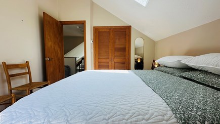 Edgartown Martha's Vineyard vacation rental - Queen bed in upstairs bedroom, flanked by a loft and a bathroom.