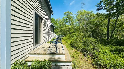 Edgartown Martha's Vineyard vacation rental - Back-of-house deck with a small sitting area.