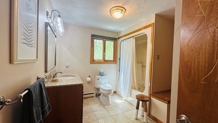 Edgartown Martha's Vineyard vacation rental - Bathroom with a granite countertop and a tub/shower combo.