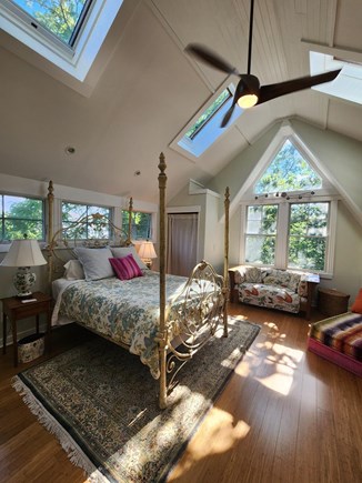 Vineyard Haven Martha's Vineyard vacation rental - Primary bedroom with large windows and skylights-tree views