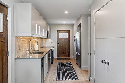 Oak Bluffs Martha's Vineyard vacation rental - Custom kitchen. 1st floor primary and full bath to the right