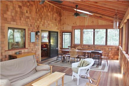 Chappaquiddick, Edgartown Martha's Vineyard vacation rental - New screened porch has dining table and seating area.