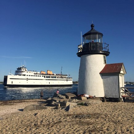 Tom Nevers East Nantucket vacation rental - The ferry passing Brant Point Lighthouse as it enters the harbor.