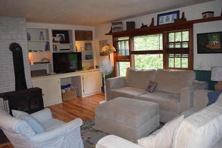 Mid-island Nantucket vacation rental - Living room with woodburning stove & Sactional couches.