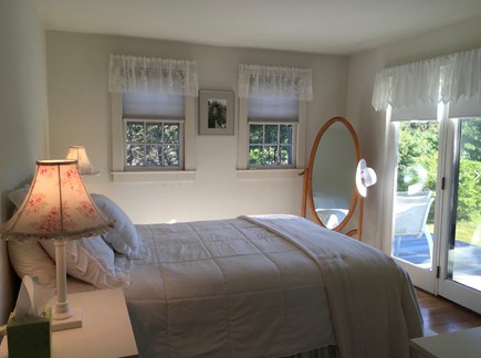 Surfside Nantucket vacation rental - Master bedroom overlooks the deck and private grounds