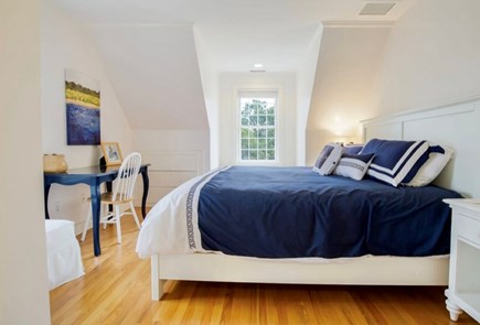 Mid-island, Miacomet Nantucket vacation rental - Master bedroom with kind-sized bed, desk, closet and drawers