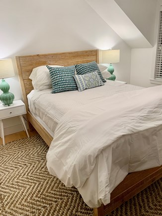 Mid-island, Surfside Nantucket vacation rental - Second floor primary queen bedroom with en suite bathroom